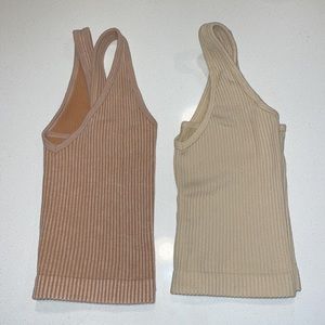 Two v-neck Aura Yoga cropped tanks